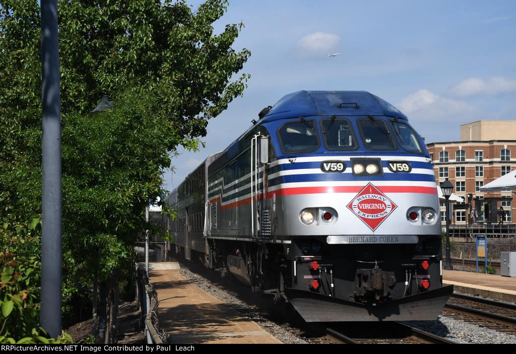 Outbound commuter approaches the station to makes its stop